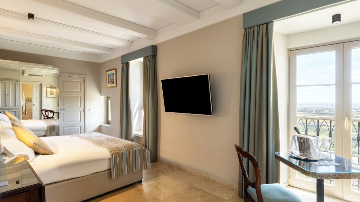 Bedroom at The Xara Palace Relais & Chateaux